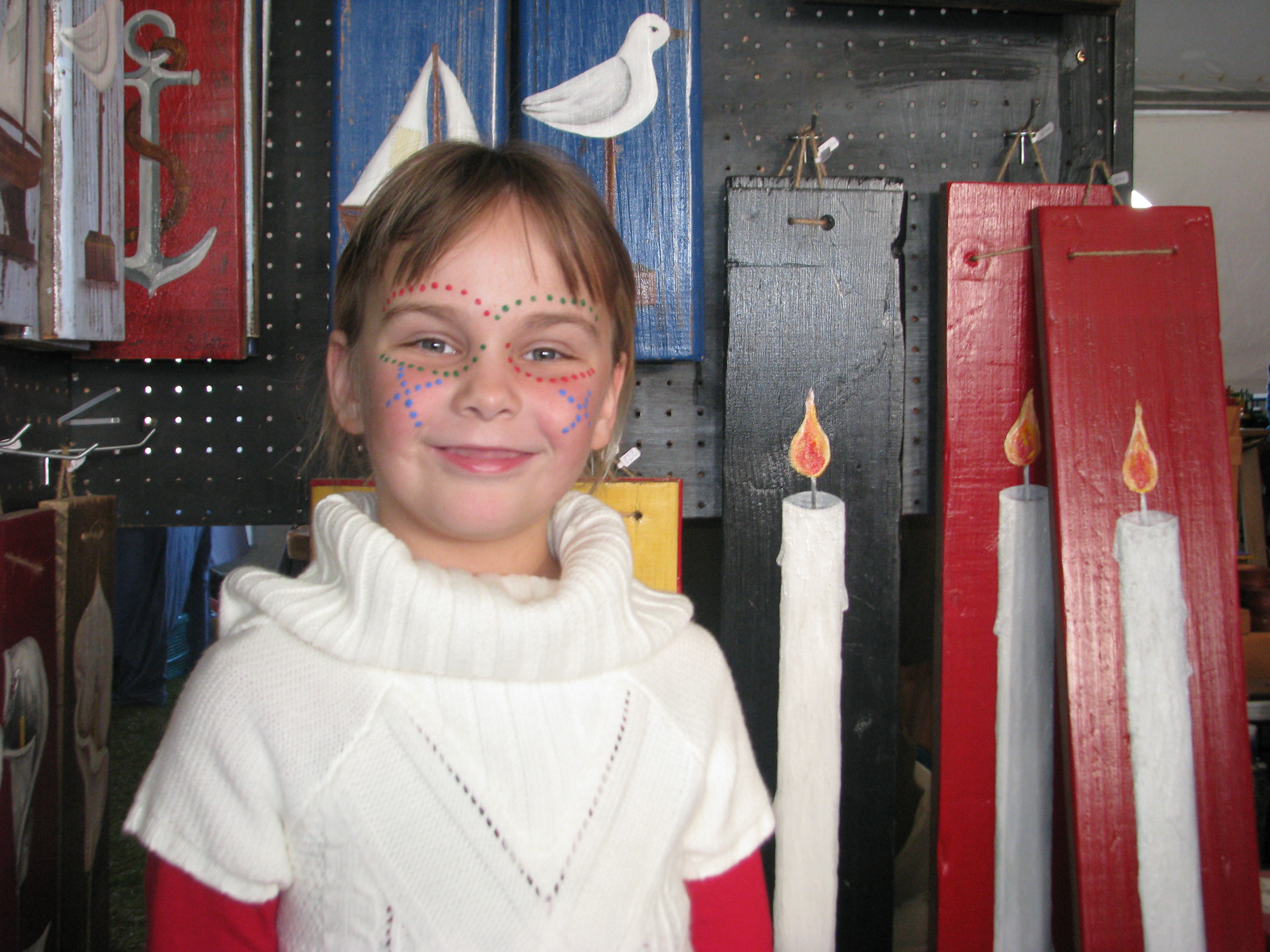 Girl with painted face smiling