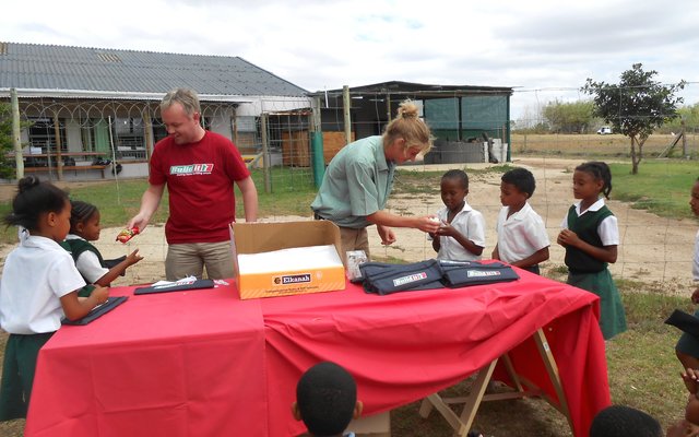 Andries and Dylan giving out treats and smiles