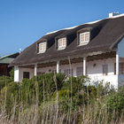 Beautiful thatch-roof houses next to the lagoon Beautiful thatch-roof houses next to the lagoon