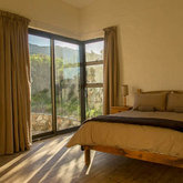 Morning light in Oxalis Cottage bedroom