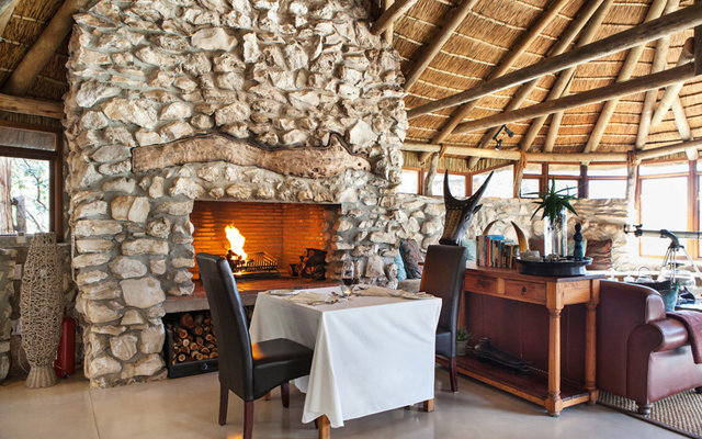 Boardwalks under a canopy of trees lead to the lounge where drinks and meals are shared outdoors or by a fireplace that will warm your soul.