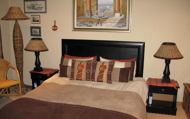 Downstairs bedroom with door to patio