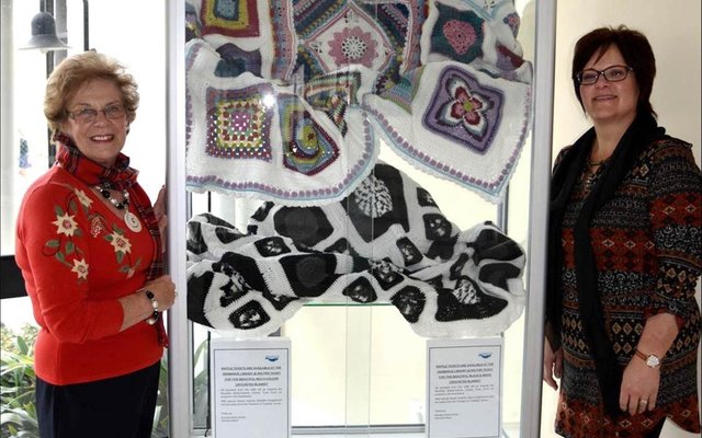 The spectacular multicoloured and black and white blankets that have been crocheted by Estrellita Engelbrecht and Jane Langenhoven and their respective teams of ladies from the “Hooked on Tuesday” Club are currently  on  display in the glass cabinet in front of the Hermanus Library. For those wanting to partake, raffle tickets are available at the Hermanus Library at a cost of R50 each for the multi-coloured blanket and R30 each for the black and white one.  Executive Mayor Nicolette Botha-Guthrie and Councillors’ Secretary Doret Taljaard pictured with the two specially handcrafted crocheted blankets that will be raffled to raise funds for various projects under the banner of the Nicolette Botha-Guthrie Charity Fund. 