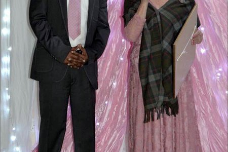 Overstrand’s Director of Economic Development, Mr. Solomzi Madikane seen receiving a long-service award from Executive Mayor, Alderlady Nicolette Botha-Guthrie  at the Councillors  End-of-Term  Farewell  Dinner.
