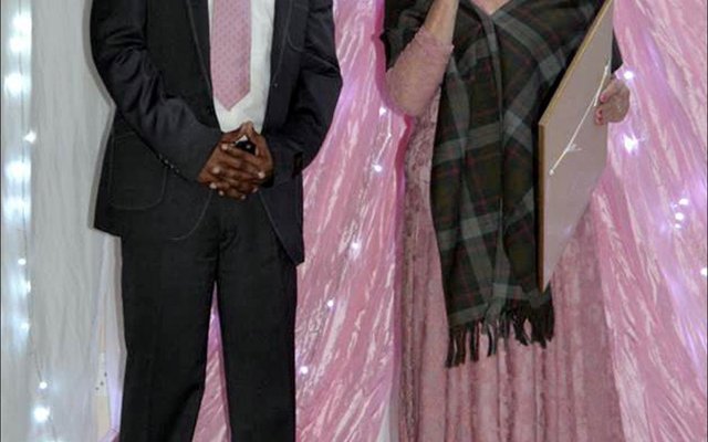 Overstrand’s Director of Economic Development, Mr. Solomzi Madikane seen receiving a long-service award from Executive Mayor, Alderlady Nicolette Botha-Guthrie  at the Councillors  End-of-Term  Farewell  Dinner.