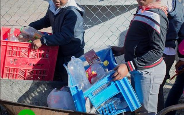 Masakhane children bring their recyclables to the Recycle Swop Shop in bags, crates, wheelbarrows or anything else they can manage.