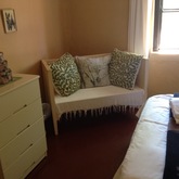 Green Cottage Main bedroom showing cot