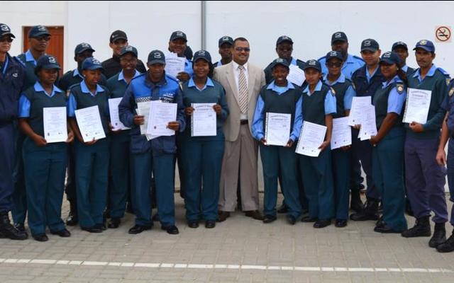 Director of Protection Services, Neville Michaels (centre) was recently pictured at a certificate handover ceremony where Law Enforcement officials were awarded certificates for completing courses in Fire Arms Training, Security and Skipper’s License.