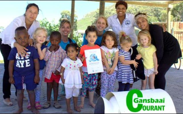 The intro class of Hermanus Montessori Private School raised R600 for African penguins and also learned a lot about them. Left is their teacher, Loren Augus and right is Pinkey Ngewu from Dyer Island Conservation Trust.