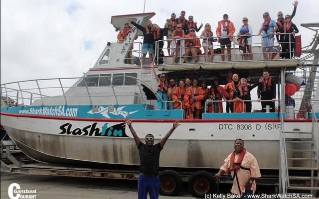 The actor and comedian, Tracy Morgan shows his excitement about the  forthcoming shark diving trip in front of the boat “Slashfin”. His brother, Jim (right) joined him.