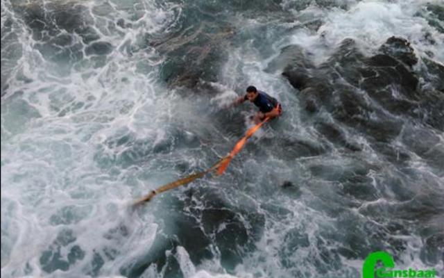 A moment in action while a crew member of NSRI is in a process of rescueing a rubberduck at sea. 