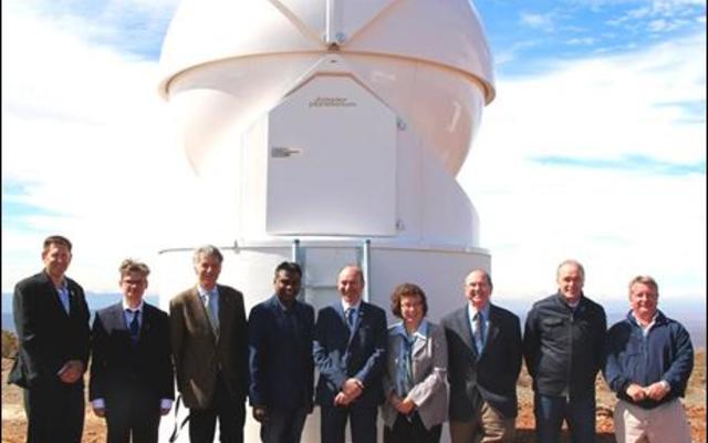 Roll players and the SANSA team in front of the space debris tracking telescope which was unveiled at the Optical Space Research (OSR) Laboratory in Sutherland. 