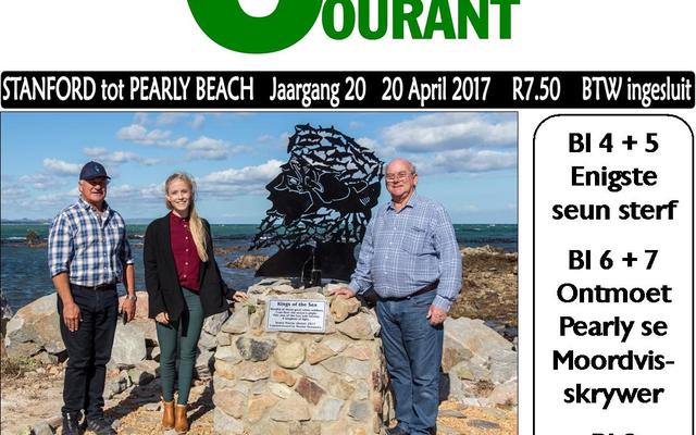 In  honour  of  the  legendary  white  sharks  in  the area, Marine Dynamics’ Wilfred Chivell commissioned Kleinbaai harbour’s first piece of art.  It was officially unveiled by Deputy Mayor Dudley Coetzee (right) during a windy  afternoon last Saturday, 15 April 2017.    Artist, Jenna Harris (middle) was commissioned to create a unique piece of art, typical of this area.  