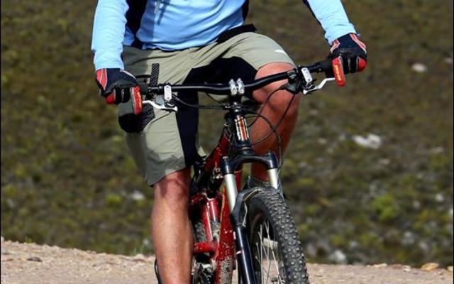 Well known dentist and enthusiastic mountain bike rider from Gansbaai, Corrie Loubser slows down at the top of the scenic Farm 215.  He was the sweeper at Saturday’s race.