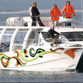 Whale watching boat and crew