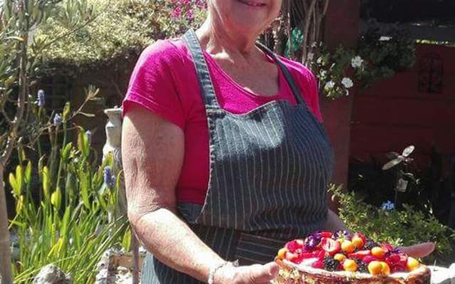 Gayle with her freshly baked berry cheese cake.