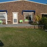 A nice cozy house with sea view and braai room with a big yard.