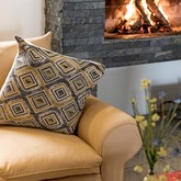 Couch by the fireplace