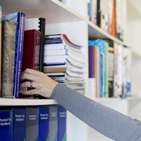 Reaching for accounting books