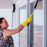 Cheryl cleaning windows