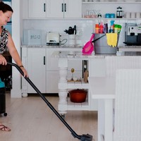 Cheryl vacuuming floors