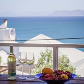 Wine and fruit on deck with sea view