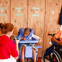 Volunteer feeding child