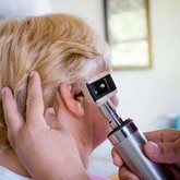 Checking patients ears