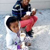 Enjoying a warm cup of soup at SHARE.