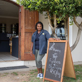 Staff member welcoming customers