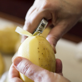 Peeling fresh potatoes