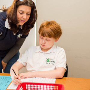 Butterfly_centre_teacher_helping_student_with_math_1528900588_1__1571308498