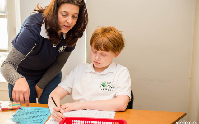 Butterfly_centre_teacher_helping_student_with_math_1528900588_1582209501