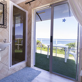 Ocean Room en-suite Shower and Toilet With View - On The Rocks B&B - Xplorio™ Gansbaai