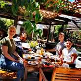 Enjoying lunch in the beautiful garden - Thyme at Rosemary's - Xplorio™ Gansbaai