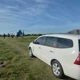 Dropping off people at the helipad that came for shark cage diving - D&J Tours - Xplorio™ Gansbaai